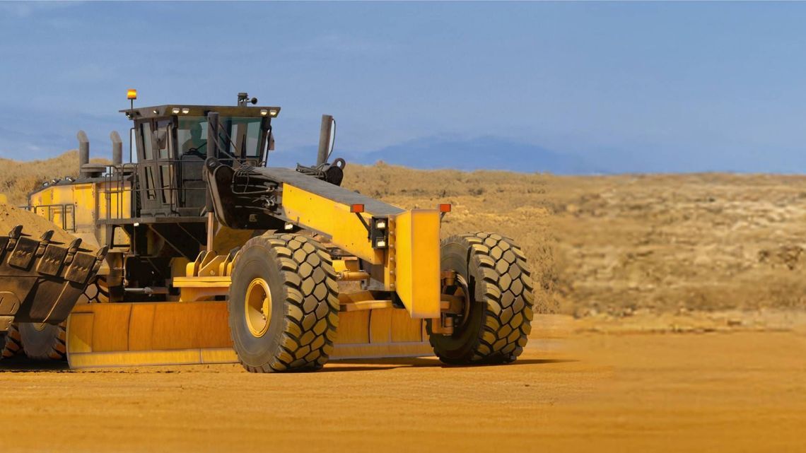 Grader machine operating in a work site