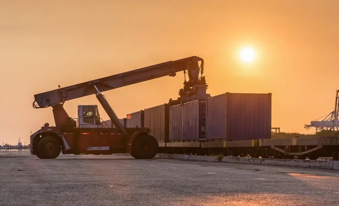 reach stacker lifting a container