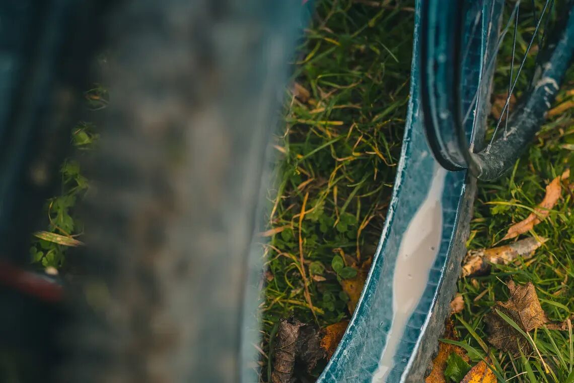 sealant being added to a tubeless bike tyre full
