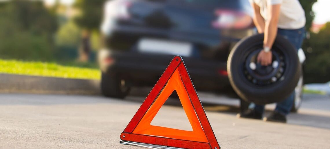 learn how to change a car tire header