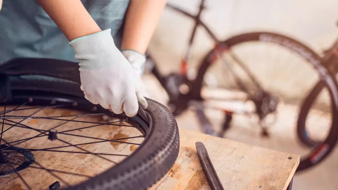 technician repairs a tire full