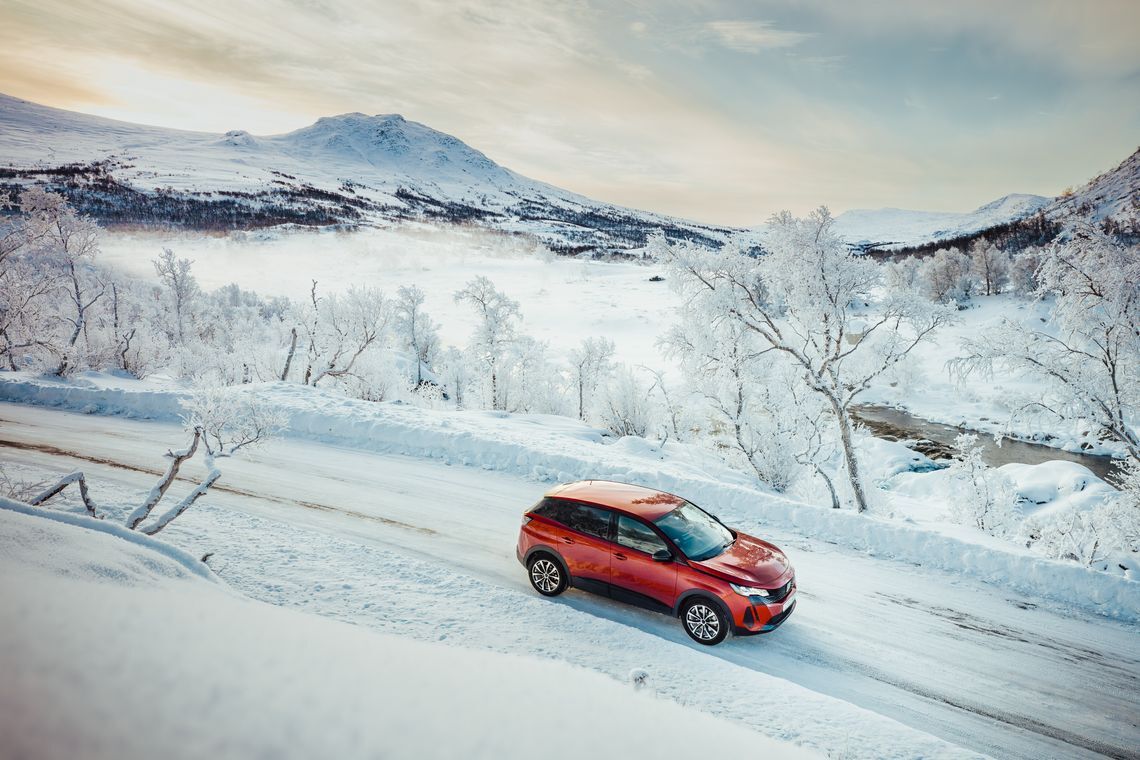 red car driving winter landscape 2