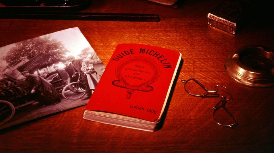 1900 Guide MICHELIN on a desk