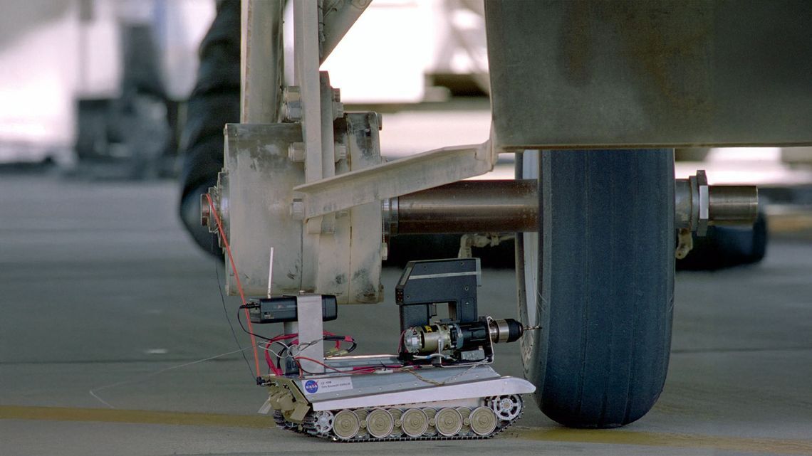 The Tire Assault Vehicle (TAV) about to drill into an overheated shuttle tire.